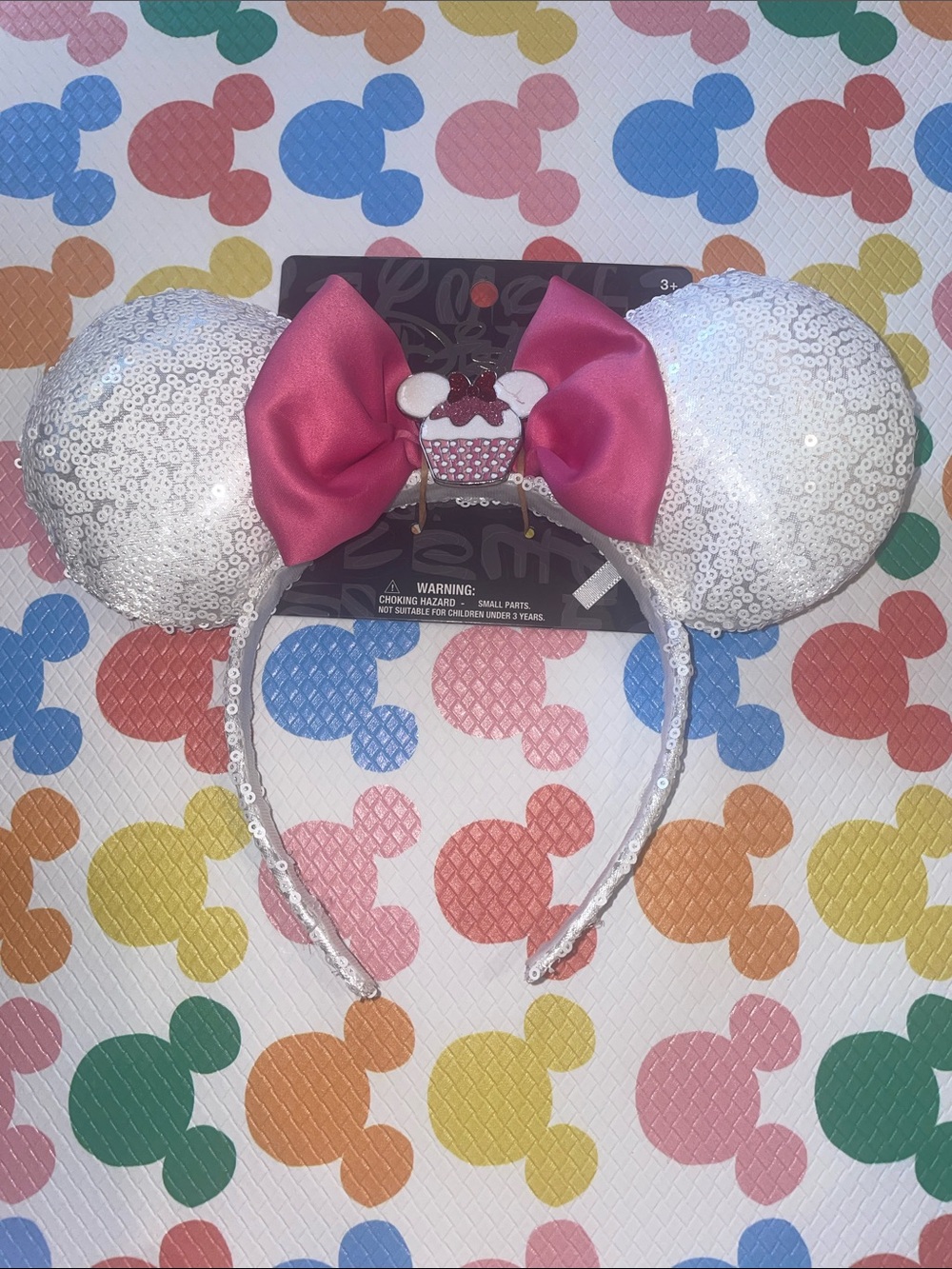 Disney Aldi White Sequin Ear Headband with Pink Bow & Cupcake Charm